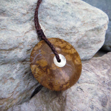 Sun and Moon Disc carved from Yellow Jasper we found at our favourite local fossicking spot.