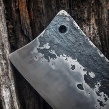 Hand forged textures in the steel from Benjamins hammer blows, blackened by fire