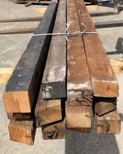 Stack of salvaged Matai planks on a concrete surface