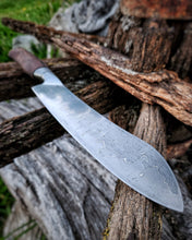 Wagon Wheel Butcher Knife with a wagon wheel wooden spoke handle with a wagon wheel wrought iron clad blade on a Victorian wagon wheel background