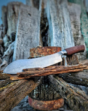 Wagon Wheel Butcher Knife with a wagon wheel wooden spoke handle with a wagon wheel wrought iron clad blade on a Victorian wagon wheel background