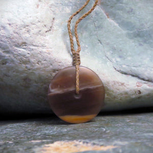 Disc Pendant carved from New Zealand Fossilized Wood.