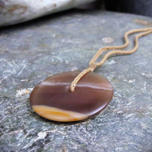 Disc Pendant carved from New Zealand Fossilized Wood.