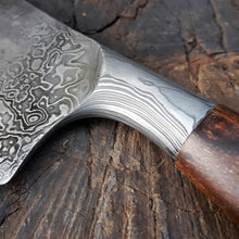 Pohutukawa Kitchen Cleaver, integral bolster detail showing the flow of contrasting steels in the hand forged Damascus.