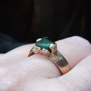 Pounamu Peak Ring. Bronze cast around authentic Pounamu from Hokitika in the South Island of New Zealand. In this photo is it worn on the hand of the maker, Marisa.