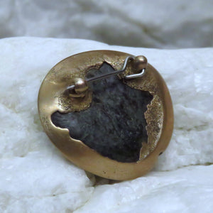 Pounamu River Pebble Brooch, reverse side view showing the pin mechanism.