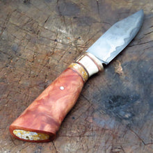 Redwood, jasper, antler and bronze handled hunting knife on a textured wooden surface.