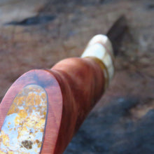 Storm Hunter showing the curves of the handle profile and the inlay of yellow jasper into the redwood.