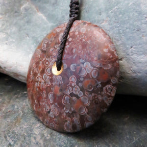 Sun and Moon Disc Pendant carved from New Zealand Spherulitic Rhyolite.