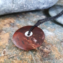 Sun and Moon Disc from Red Jasper we found at our favourite local fossicking spot. This side shows the silver leaf gilded centre.