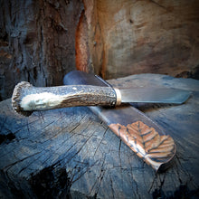 Hand forged, hand carved Woodsman Seax and its custom made leather sheath with repousse copper leaf detail